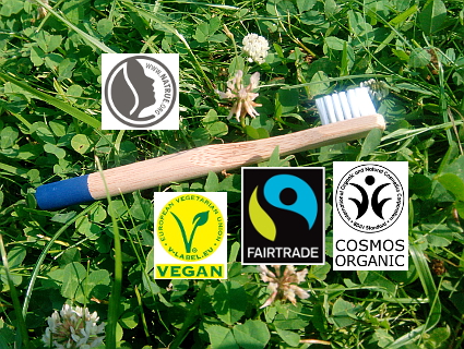 Zahnbürste mit vier Logos für nachhaltige Produkte